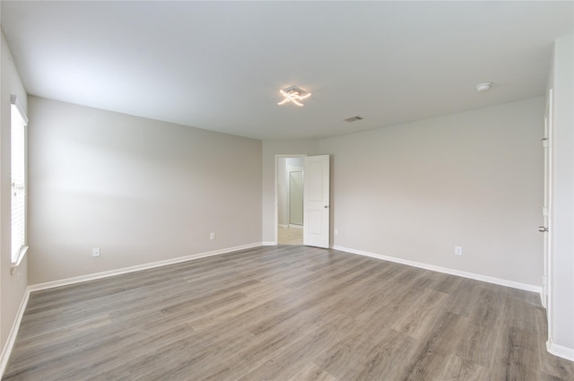 9207 Ranch Ridge Ln, Richmond, TX 77407 - empty room with wood finished floors and baseboards