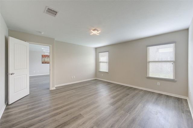 9207 Ranch Ridge Ln, Richmond, TX 77407 - unfurnished room with wood finished floors and a smoke detector