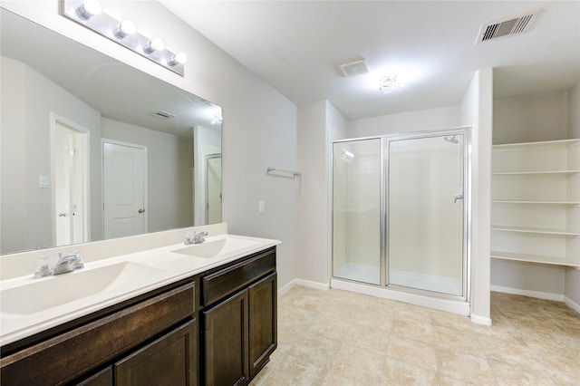 9207 Ranch Ridge Ln, Richmond, TX 77407 - bathroom with double vanity, a stall shower, and tile patterned floors