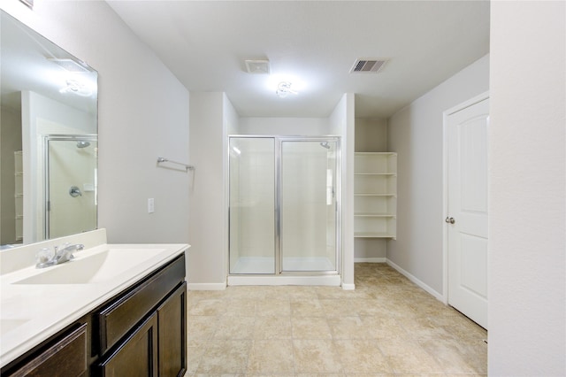 9207 Ranch Ridge Ln, Richmond, TX 77407 - bathroom with a shower stall, double vanity, and tile patterned floors