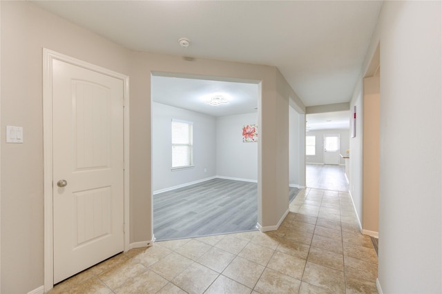 9207 Ranch Ridge Ln, Richmond, TX 77407 - hallway featuring healthy amount of natural light and light tile patterned floors