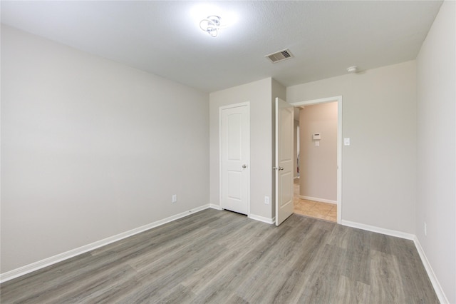 9207 Ranch Ridge Ln, Richmond, TX 77407 - unfurnished bedroom featuring light wood-style flooring and baseboards
