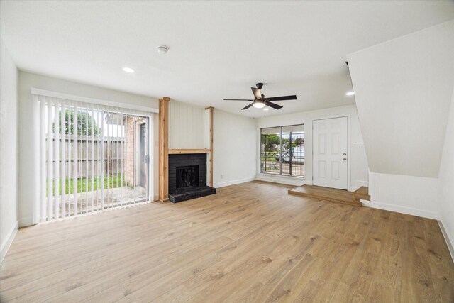7822 Pacific Pearl St, Houston, TX 77072 - unfurnished living room featuring a ceiling fan, light wood-style flooring, a fireplace, and recessed lighting