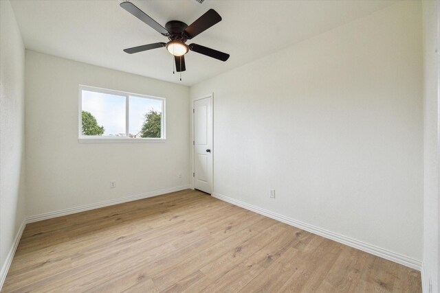 7822 Pacific Pearl St, Houston, TX 77072 - spare room featuring light wood-type flooring and ceiling fan