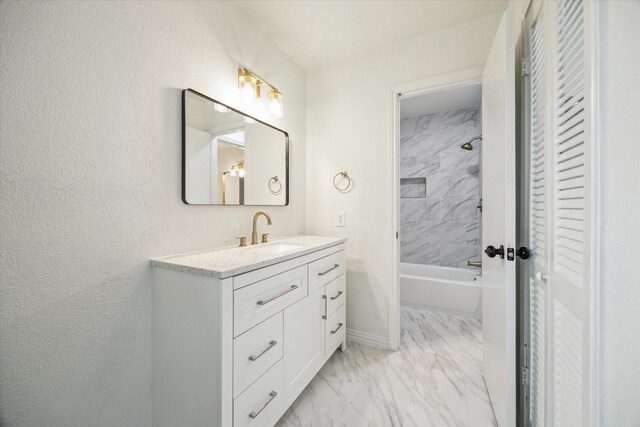 7822 Pacific Pearl St, Houston, TX 77072 - bathroom with marble finish floors, a closet, vanity, and tub / shower combination