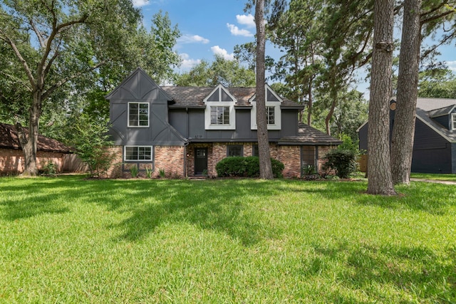 6515 Pebble Beach Dr, Houston, TX 77069 - tudor-style house with stucco siding, brick siding, and a front yard