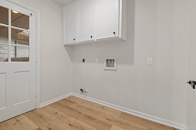 6515 Pebble Beach Dr, Houston, TX 77069 - laundry room featuring hookup for a washing machine, electric dryer hookup, light wood-style floors, and cabinet space