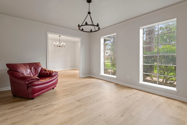 6515 Pebble Beach Dr, Houston, TX 77069 - living area featuring a chandelier, wood finished floors, and ornamental molding