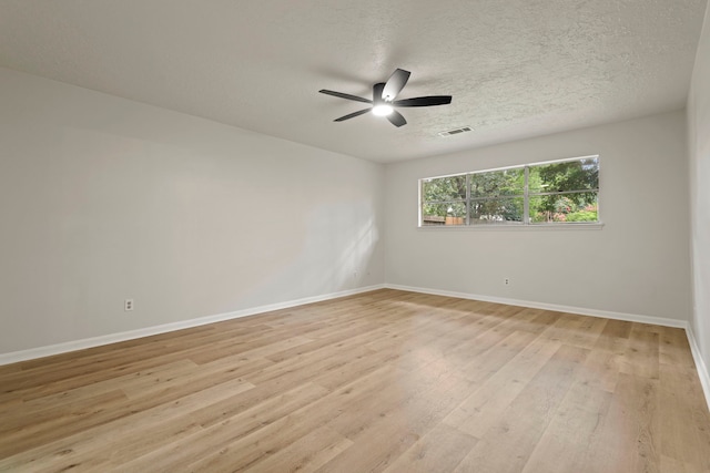 6515 Pebble Beach Dr, Houston, TX 77069 - spare room with light wood-style flooring, a textured ceiling, and a ceiling fan