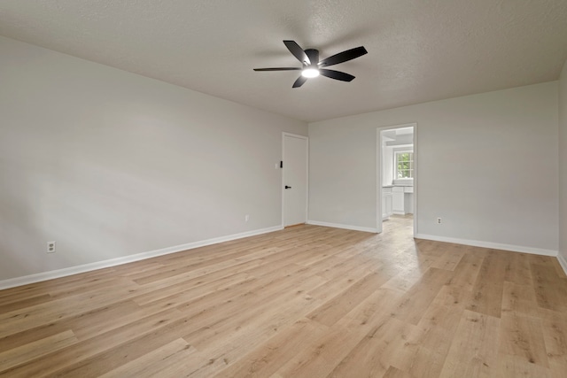 6515 Pebble Beach Dr, Houston, TX 77069 - unfurnished room with ceiling fan, light wood-style floors, and a textured ceiling