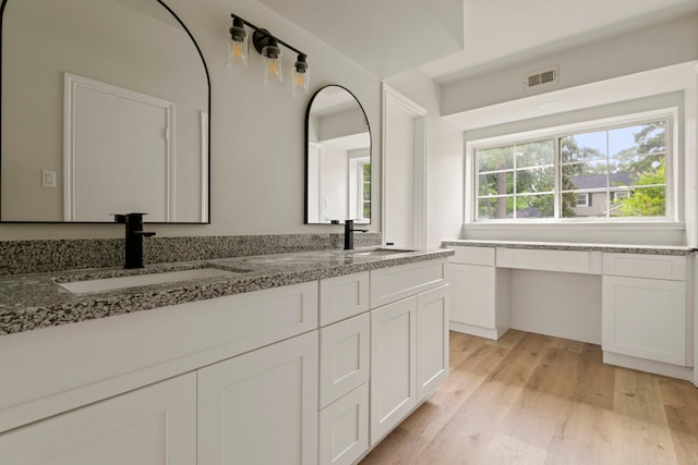 6515 Pebble Beach Dr, Houston, TX 77069 - full bathroom with double vanity and wood finished floors