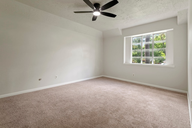 6515 Pebble Beach Dr, Houston, TX 77069 - carpeted spare room featuring a textured ceiling, a ceiling fan, and vaulted ceiling