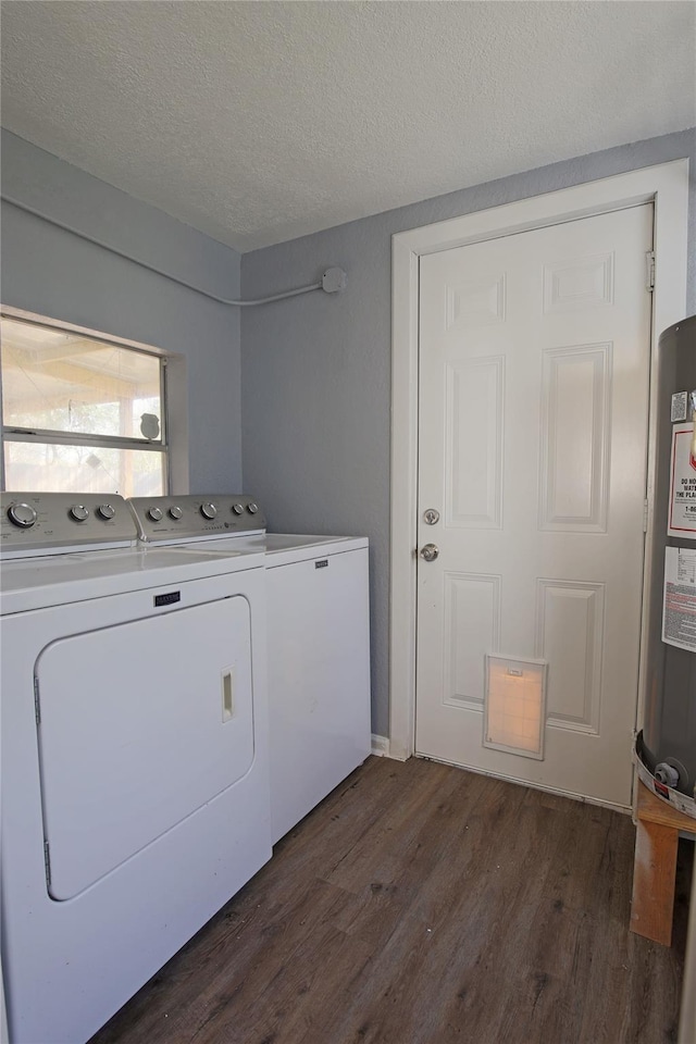 1305 Fairview Dr, Alvin, TX 77511 - laundry room with washer and dryer, dark wood-style floors, a textured ceiling, and water heater