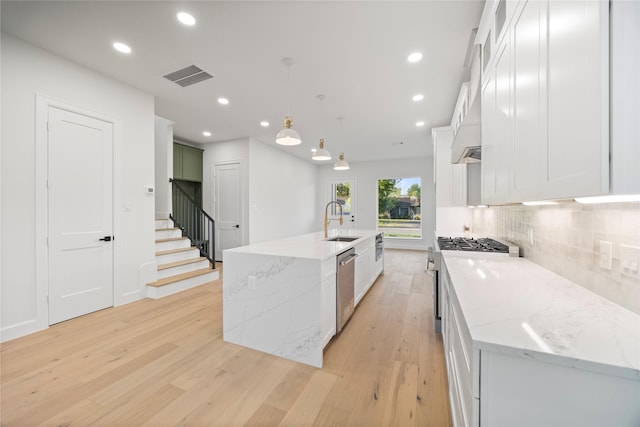 8646 Alcott Dr, Houston, TX 77080 - kitchen with range, dishwasher, light wood-style flooring, tasteful backsplash, and recessed lighting