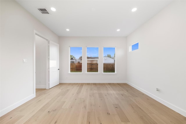 8646 Alcott Dr, Houston, TX 77080 - empty room with light wood-style flooring, plenty of natural light, and recessed lighting