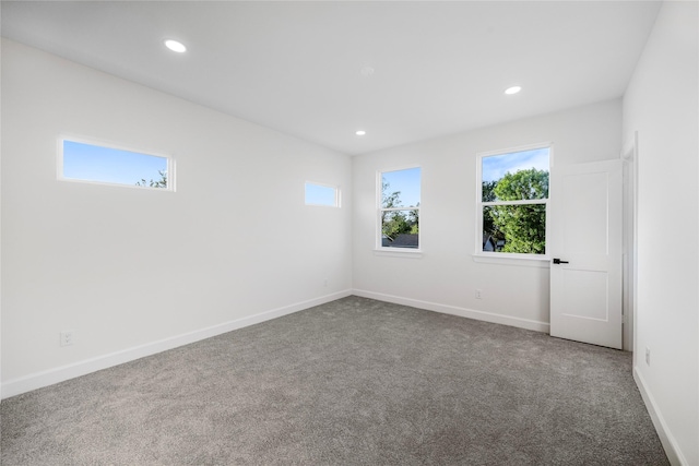 8646 Alcott Dr, Houston, TX 77080 - unfurnished room featuring carpet flooring, healthy amount of natural light, and recessed lighting
