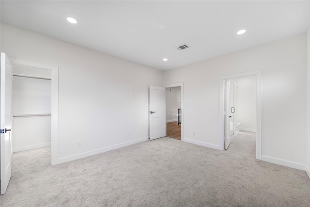 8646 Alcott Dr, Houston, TX 77080 - unfurnished bedroom with carpet, a walk in closet, recessed lighting, connected bathroom, and a closet