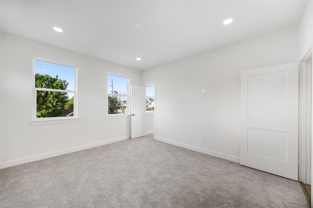 8646 Alcott Dr, Houston, TX 77080 - empty room featuring light carpet and recessed lighting