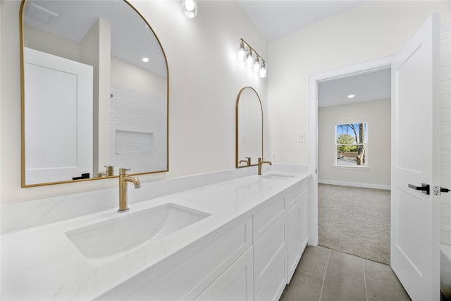8646 Alcott Dr, Houston, TX 77080 - bathroom featuring double vanity, tile patterned floors, and recessed lighting
