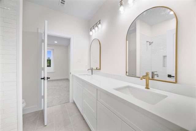 8646 Alcott Dr, Houston, TX 77080 - bathroom featuring double vanity, tile patterned floors, and a shower