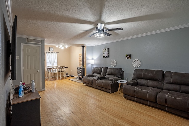 541 N Village Creek Pkwy, Lumberton, TX 77657 - living area with ceiling fan, ornamental molding, light wood-style floors, and a textured ceiling