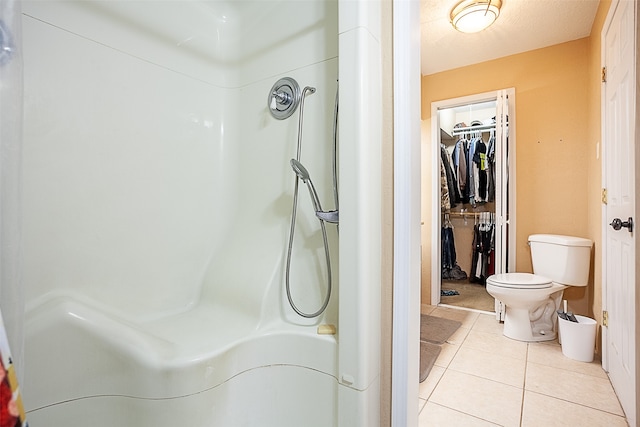 541 N Village Creek Pkwy, Lumberton, TX 77657 - bathroom featuring tile patterned floors, a shower, and a spacious closet