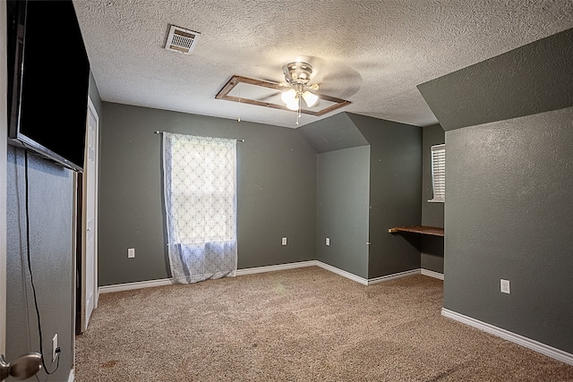 541 N Village Creek Pkwy, Lumberton, TX 77657 - bonus room featuring ceiling fan, carpet floors, a textured ceiling, vaulted ceiling, and a textured wall