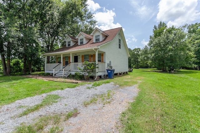 541 N Village Creek Pkwy, Lumberton, TX 77657 - cape cod home featuring covered porch and a front yard