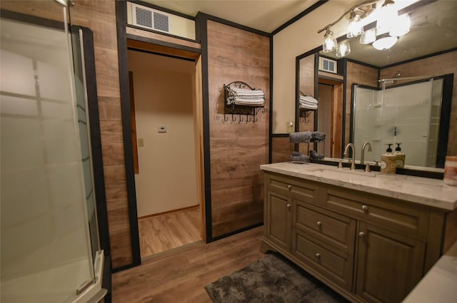 507 W Fawn St, Caldwell, TX 77836 - bathroom featuring vanity, a shower stall, and wood finished floors