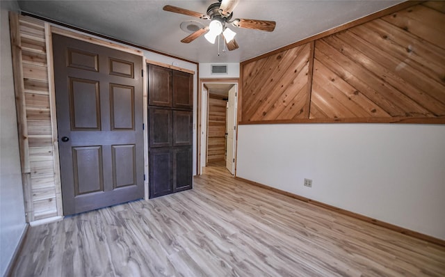 507 W Fawn St, Caldwell, TX 77836 - unfurnished bedroom with light wood-type flooring, ceiling fan, and a closet