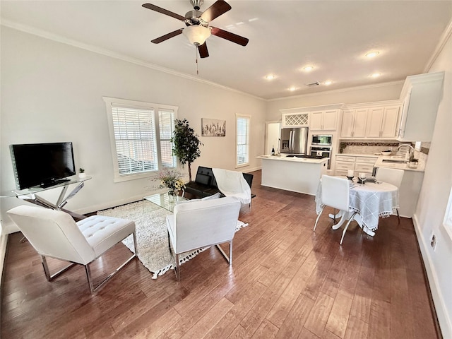 615 Allston St, Houston, TX 77007 - living room with ornamental molding, dark wood-style floors, and ceiling fan