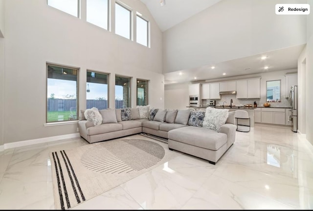 8922 Granary Gate Ln, Richmond, TX 77407 - living area featuring light marble finish floors and high vaulted ceiling