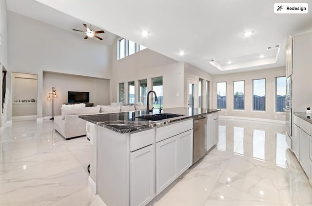 8922 Granary Gate Ln, Richmond, TX 77407 - kitchen featuring dishwasher, open floor plan, light marble finish flooring, dark stone countertops, and recessed lighting