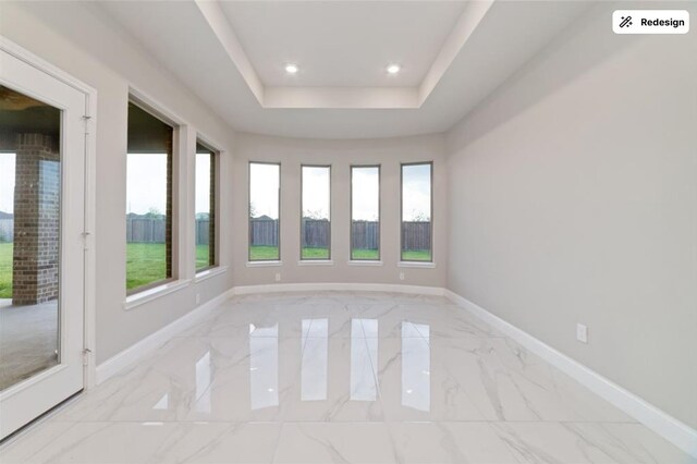 8922 Granary Gate Ln, Richmond, TX 77407 - empty room featuring marble finish flooring, plenty of natural light, recessed lighting, and a raised ceiling
