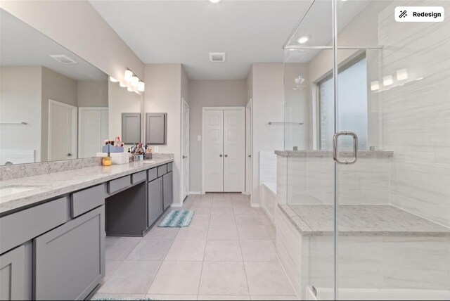 8922 Granary Gate Ln, Richmond, TX 77407 - full bathroom featuring double vanity, a stall shower, tile patterned floors, a tub to relax in, and recessed lighting