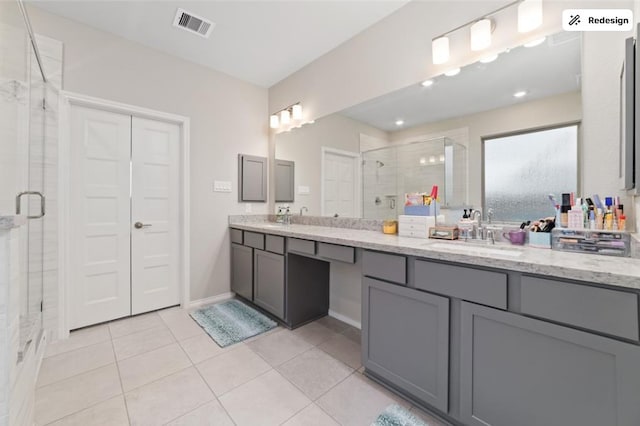 8922 Granary Gate Ln, Richmond, TX 77407 - full bath with a stall shower, double vanity, and tile patterned flooring