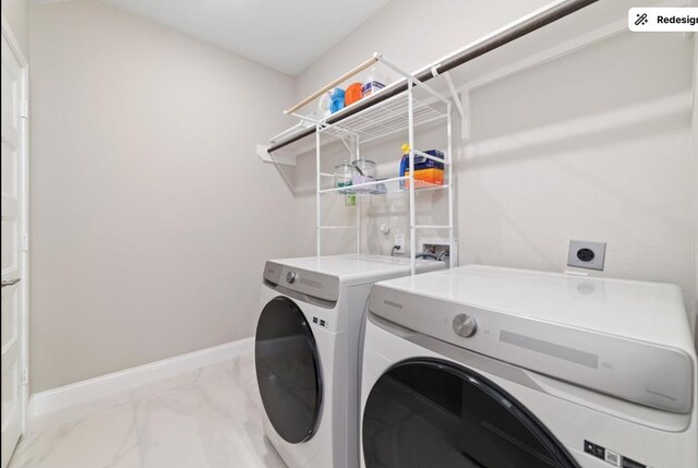 8922 Granary Gate Ln, Richmond, TX 77407 - washroom featuring washing machine and clothes dryer and marble finish floors