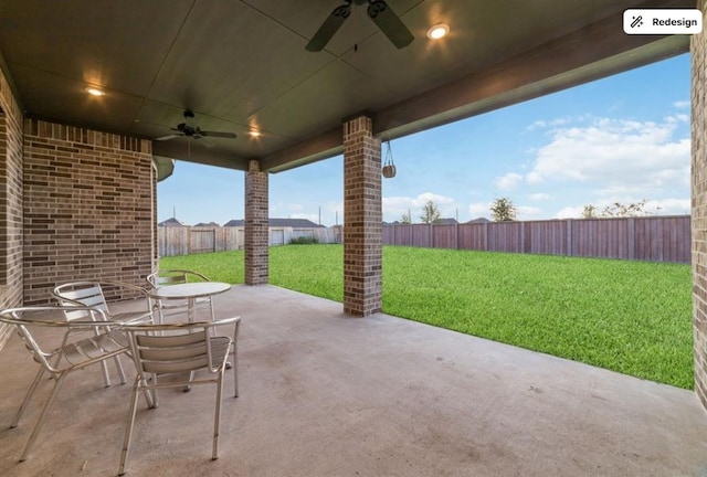 8922 Granary Gate Ln, Richmond, TX 77407 - fenced backyard with ceiling fan and a patio area