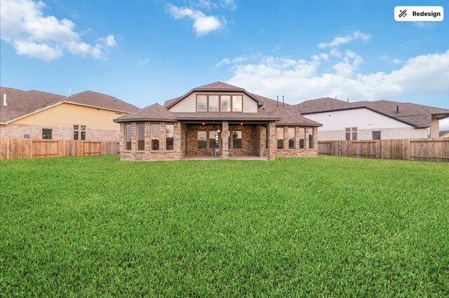 8922 Granary Gate Ln, Richmond, TX 77407 - rear view of property featuring a fenced backyard, brick siding, and a patio