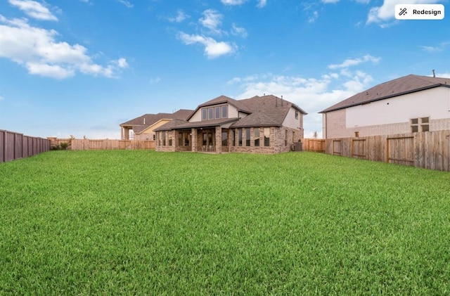 8922 Granary Gate Ln, Richmond, TX 77407 - rear view of house featuring a fenced backyard and stone siding