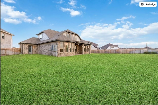 8922 Granary Gate Ln, Richmond, TX 77407 - back of house featuring brick siding and a fenced backyard