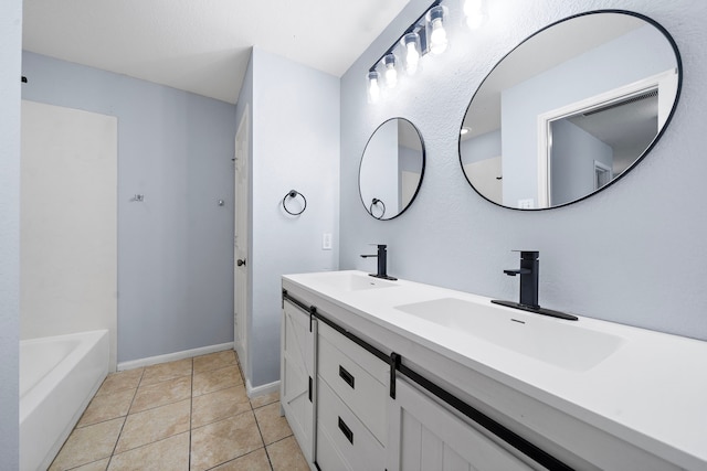 6306 Channelbrook Ln, Spring, TX 77379 - bathroom featuring double vanity and tile patterned floors