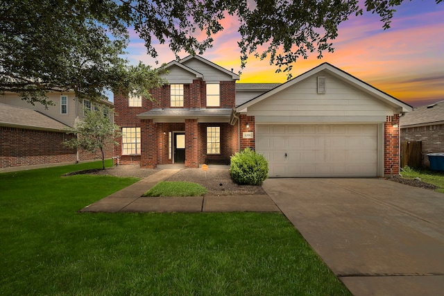 6306 Channelbrook Ln, Spring, TX 77379 - traditional-style house with concrete driveway, brick siding, a lawn, and a garage