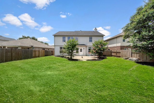 6306 Channelbrook Ln, Spring, TX 77379 - back of property featuring a patio area, a fenced backyard, and a chimney