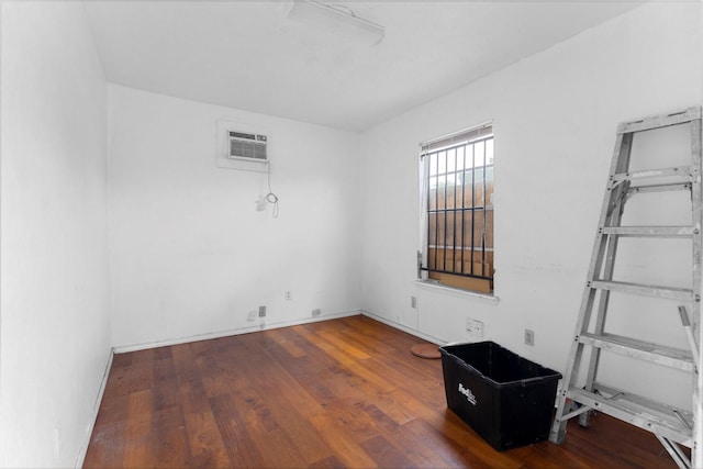 1028 N Victory Dr, Houston, TX 77088 - unfurnished room featuring wood finished floors and a wall mounted air conditioner