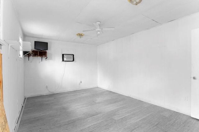 1028 N Victory Dr, Houston, TX 77088 - spare room with wood finished floors, a ceiling fan, and a wall unit AC