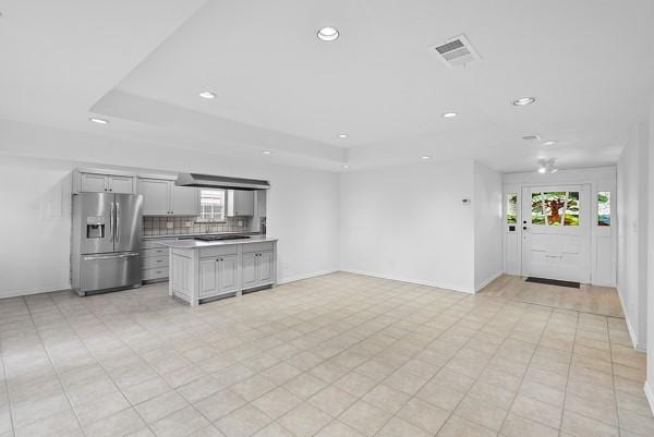 14419 Crosshaven Dr, Houston, TX 77015 - unfurnished living room with recessed lighting, healthy amount of natural light, and a raised ceiling