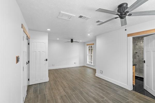 14419 Crosshaven Dr, Houston, TX 77015 - empty room with a ceiling fan, recessed lighting, and dark wood-style floors