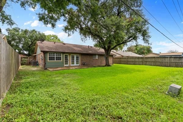 14419 Crosshaven Dr, Houston, TX 77015 - rear view of house with french doors and a fenced backyard