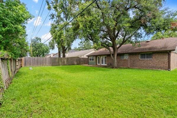 14419 Crosshaven Dr, Houston, TX 77015 - fenced backyard with french doors